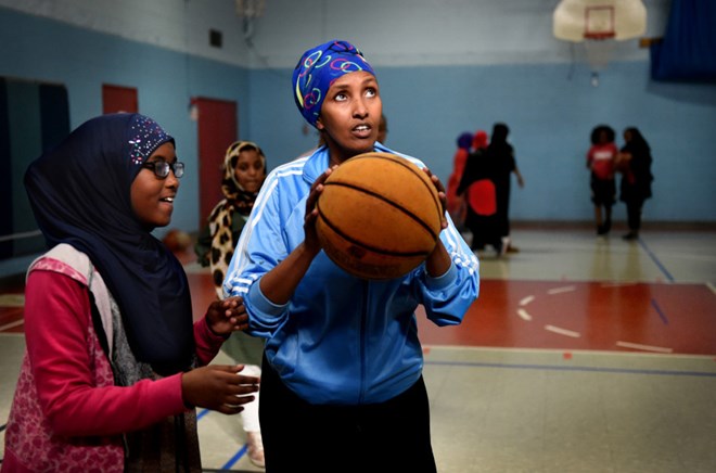 Fartun Osman, center, coaches basketball teams at West Minnehaha Recreation Center in St. Paul on Wednesday, April 5, 2017. Fartun, a physical education teacher at Higher Ground Academy charter school in St. Paul was supposed to coach the Somali national women’s basketball team in a tournament last month in Egypt. It would have been the country’s first such team in 26 years, but most of the team got stuck in Dubai because of visa problems. Jean Pieri / Pioneer Press